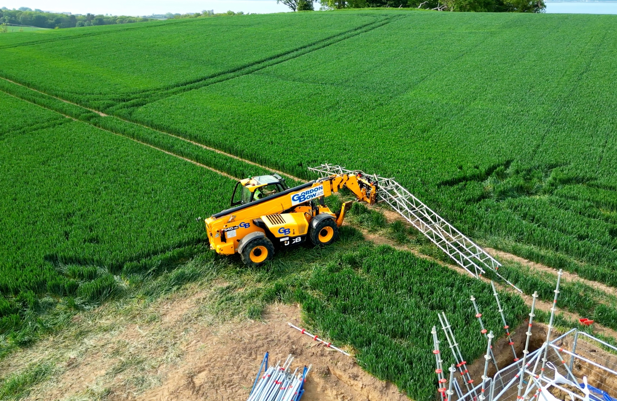 Aerial drone shot of Gordon Bow machinery working in a field